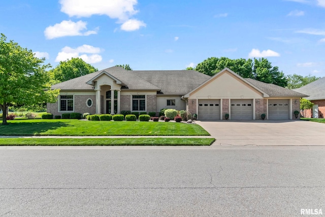 4901 Wildcat Run, Springfield, IL 62711 - view of front facade with an attached garage, concrete driveway, a front lawn, and brick siding