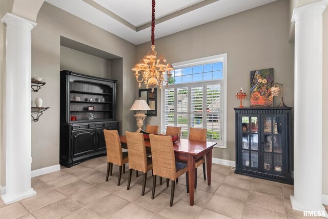 4901 Wildcat Run, Springfield, IL 62711 - dining space with ornate columns, a chandelier, and baseboards