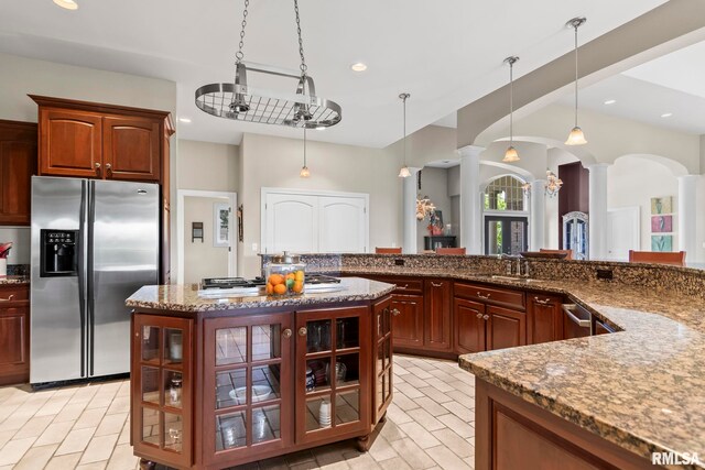 4901 Wildcat Run, Springfield, IL 62711 - kitchen featuring appliances with stainless steel finishes, ornate columns, light stone counters, pendant lighting, and recessed lighting