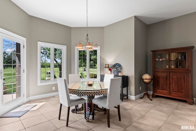 4901 Wildcat Run, Springfield, IL 62711 - dining area with a chandelier, light tile patterned floors, and baseboards