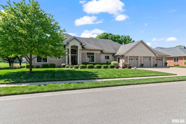 4901 Wildcat Run, Springfield, IL 62711 - view of front of house with a garage, a front yard, concrete driveway, and brick siding