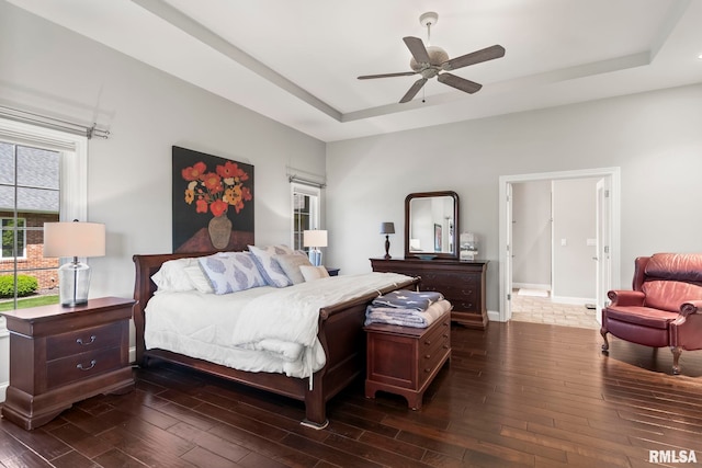 4901 Wildcat Run, Springfield, IL 62711 - bedroom with a tray ceiling, dark wood-type flooring, baseboards, and a ceiling fan