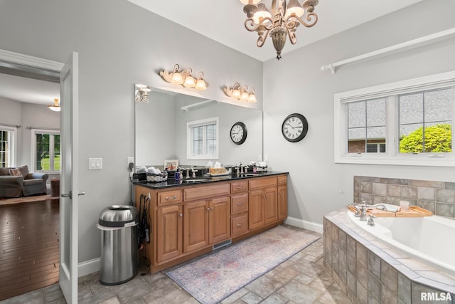 4901 Wildcat Run, Springfield, IL 62711 - bathroom featuring a chandelier, stone tile floors, and baseboards
