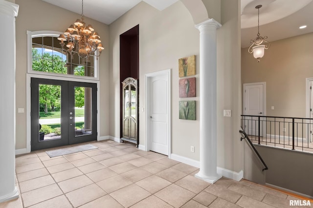 4901 Wildcat Run, Springfield, IL 62711 - entryway featuring a towering ceiling, plenty of natural light, decorative columns, a chandelier, and french doors