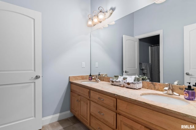 4901 Wildcat Run, Springfield, IL 62711 - full bathroom with tile patterned flooring, double vanity, and baseboards