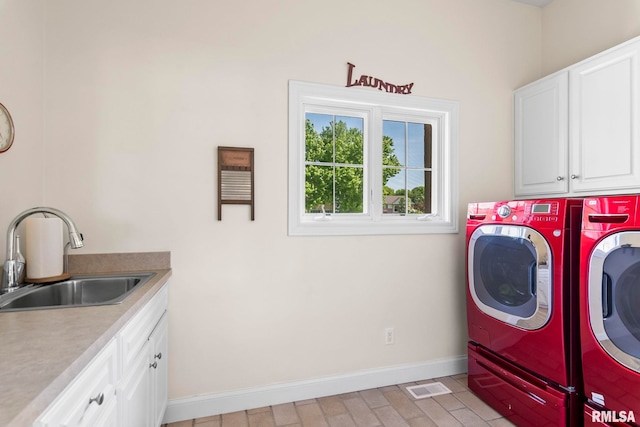 4901 Wildcat Run, Springfield, IL 62711 - laundry area featuring cabinet space, washer and dryer, and baseboards