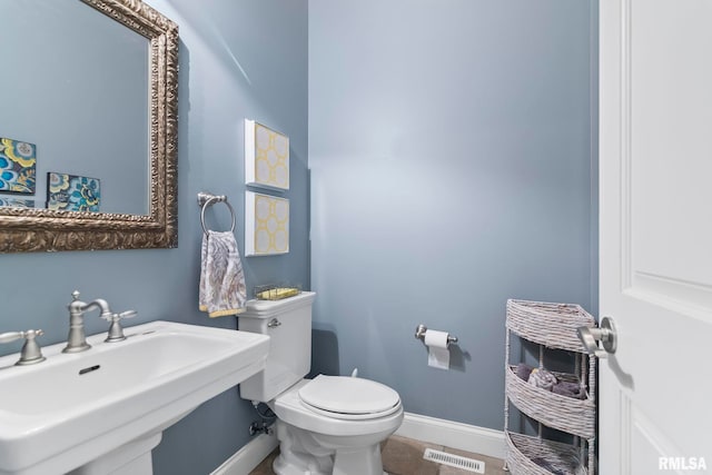 4901 Wildcat Run, Springfield, IL 62711 - bathroom featuring baseboards, a sink, toilet, and tile patterned floors