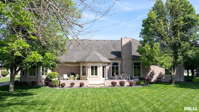 4901 Wildcat Run, Springfield, IL 62711 - back of property featuring a yard, a patio, roof with shingles, and brick siding