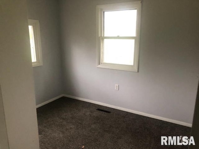 1522 Rim Rd, Quincy, IL 62305 - carpeted empty room with plenty of natural light and baseboards