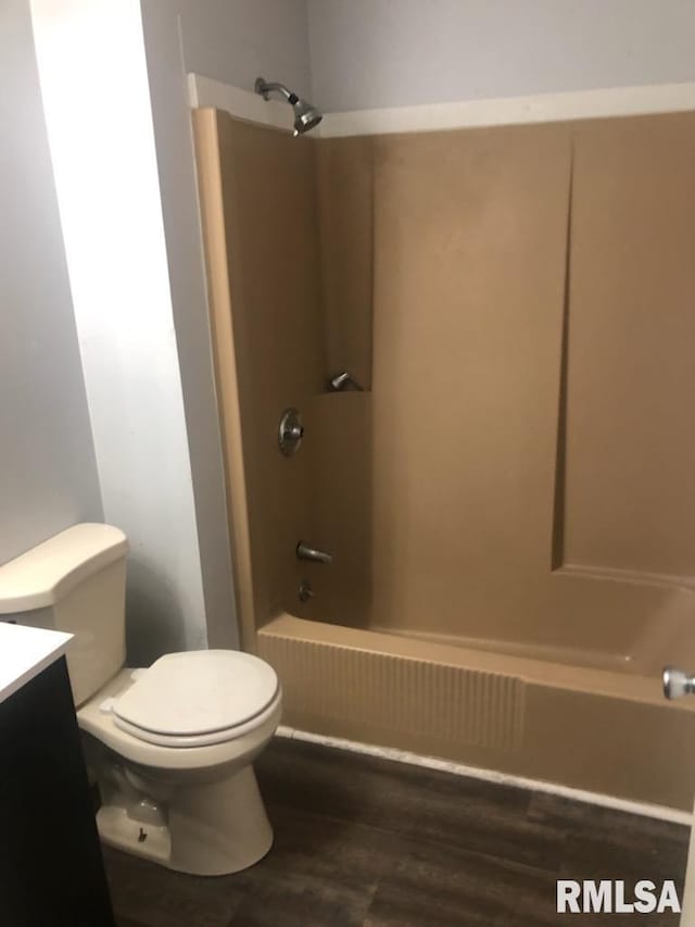 1522 Rim Rd, Quincy, IL 62305 - full bathroom with vanity, toilet, bathing tub / shower combination, and wood finished floors
