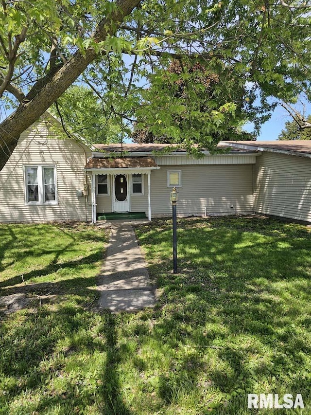 300 W Prairie St, Camp Point, IL 62320 - view of front of house featuring a front lawn and a porch