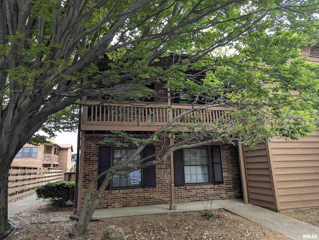 160 S Durkin Dr Unit 11, Springfield, IL 62704 - view of side of home featuring brick siding and fence