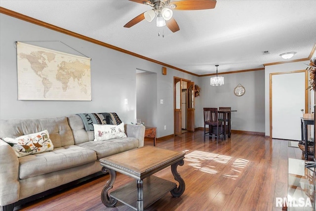 160 S Durkin Dr Unit 11, Springfield, IL 62704 - living room with a ceiling fan, wood finished floors, crown molding, baseboards, and a textured ceiling