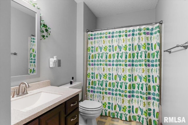 160 S Durkin Dr Unit 11, Springfield, IL 62704 - full bath featuring toilet, a shower with shower curtain, vanity, and a textured ceiling
