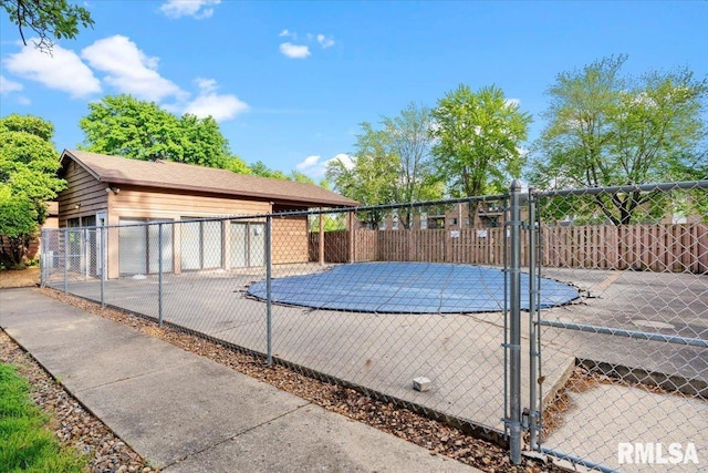 160 S Durkin Dr Unit 11, Springfield, IL 62704 - view of pool featuring fence, a gate, and an outdoor structure