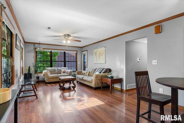 160 S Durkin Dr Unit 11, Springfield, IL 62704 - living area featuring a textured ceiling, dark wood-type flooring, crown molding, ceiling fan, and baseboards
