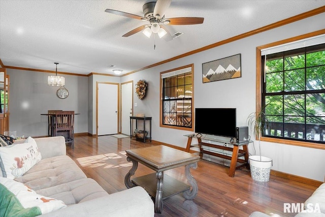 160 S Durkin Dr Unit 11, Springfield, IL 62704 - living area featuring wood finished floors, crown molding, baseboards, a ceiling fan, and a textured ceiling