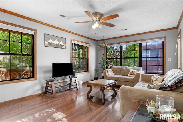 160 S Durkin Dr Unit 11, Springfield, IL 62704 - living area featuring wood finished floors, a ceiling fan, healthy amount of natural light, a textured ceiling, and baseboards