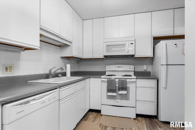 160 S Durkin Dr Unit 11, Springfield, IL 62704 - kitchen featuring white appliances, a sink, white cabinetry, wood finished floors, and a textured ceiling