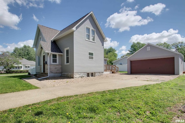 801 S 22nd St, Quincy, IL 62301 - view of property exterior with an outdoor structure, a garage, a yard, and roof with shingles