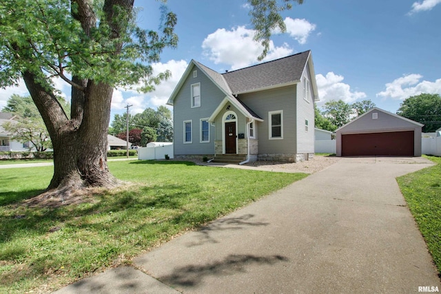 801 S 22nd St, Quincy, IL 62301 - view of front of house with a detached garage, an outdoor structure, and a shingled roof