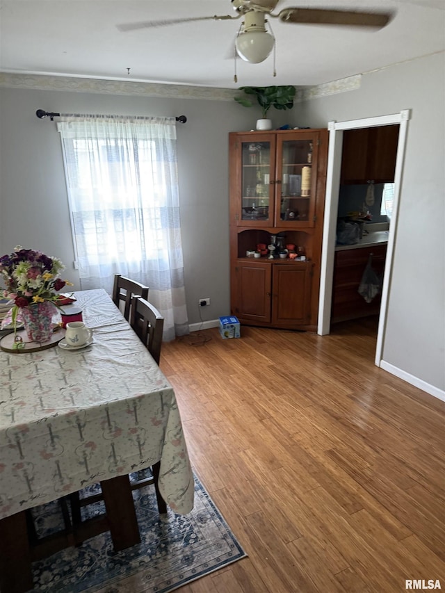 2853 Hoover Ave, Springfield, IL 62703 - dining area featuring ceiling fan, light wood finished floors, and baseboards