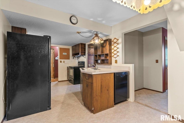 34831 Greenland Rd, Virden, IL 62690 - kitchen with black appliances, light countertops, light colored carpet, a sink, and brown cabinetry