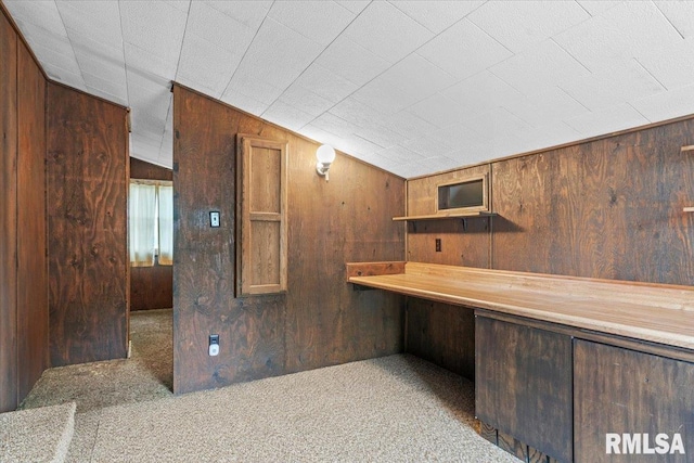 34831 Greenland Rd, Virden, IL 62690 - bar with wood walls, carpet floors, and built in desk
