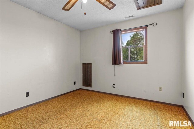 34831 Greenland Rd, Virden, IL 62690 - empty room with light colored carpet, a ceiling fan, baseboards, and a textured ceiling