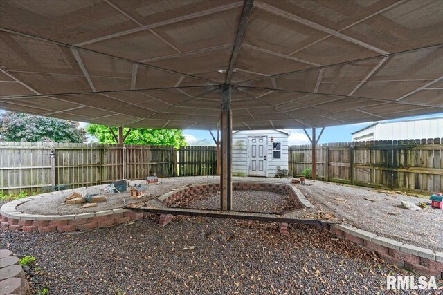 34831 Greenland Rd, Virden, IL 62690 - fenced backyard with an outbuilding and a storage shed