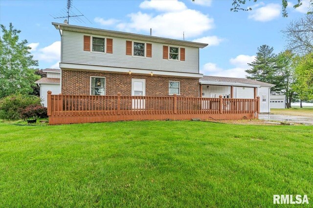 34831 Greenland Rd, Virden, IL 62690 - rear view of house with a lawn, brick siding, and a wooden deck