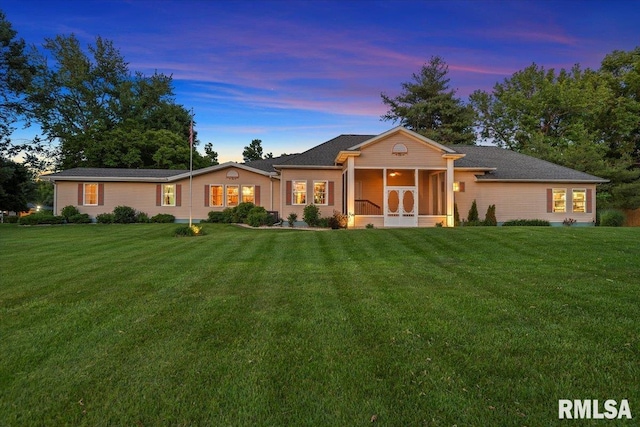 4 Nightingale Dr, Springfield, IL 62711 - ranch-style house with a lawn and a sunroom