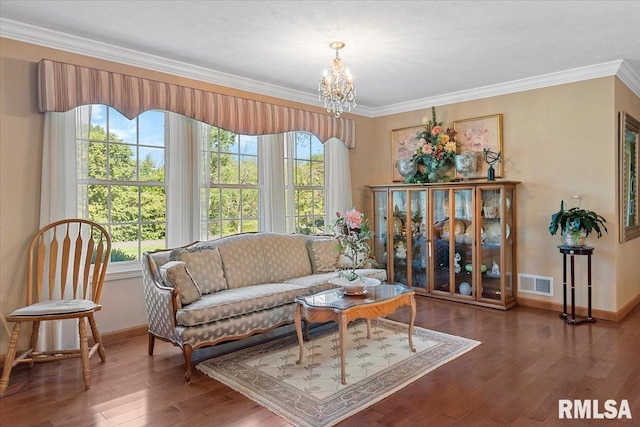 4 Nightingale Dr, Springfield, IL 62711 - living room with baseboards, a chandelier, wood finished floors, and crown molding