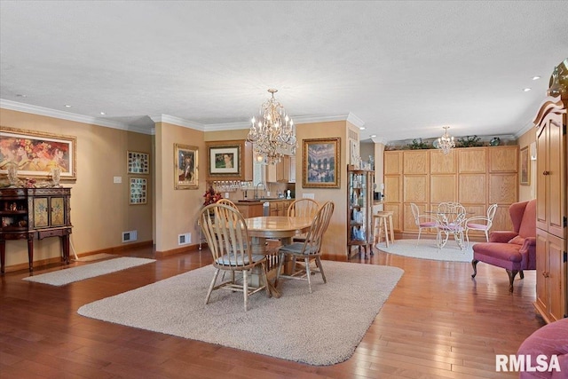 4 Nightingale Dr, Springfield, IL 62711 - dining room with a chandelier, baseboards, hardwood / wood-style flooring, crown molding, and recessed lighting
