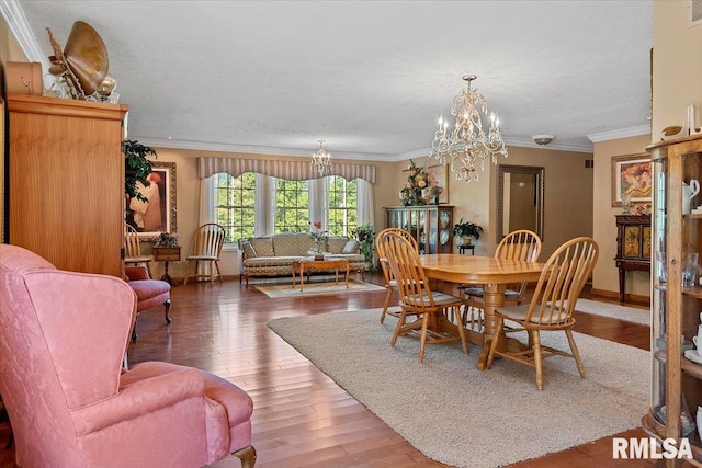 4 Nightingale Dr, Springfield, IL 62711 - dining room featuring a chandelier, light wood-type flooring, crown molding, and baseboards