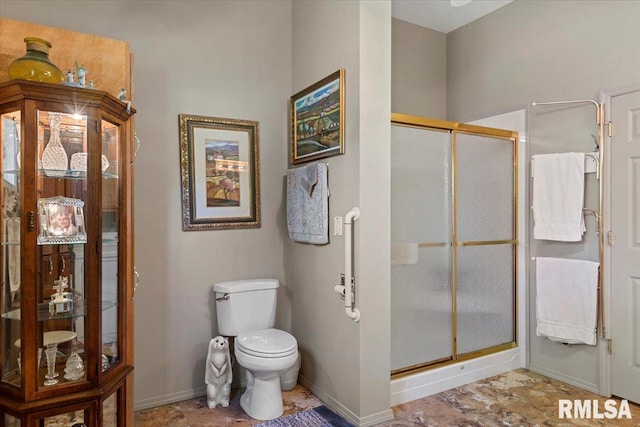 4 Nightingale Dr, Springfield, IL 62711 - bathroom with a shower stall, toilet, and baseboards