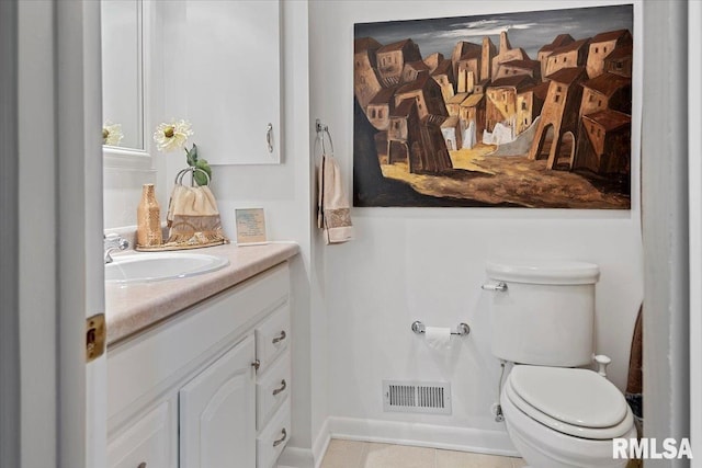 4 Nightingale Dr, Springfield, IL 62711 - bathroom featuring toilet, vanity, and tile patterned flooring