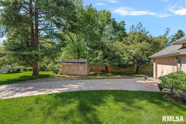 4 Nightingale Dr, Springfield, IL 62711 - view of yard featuring concrete driveway and a patio area