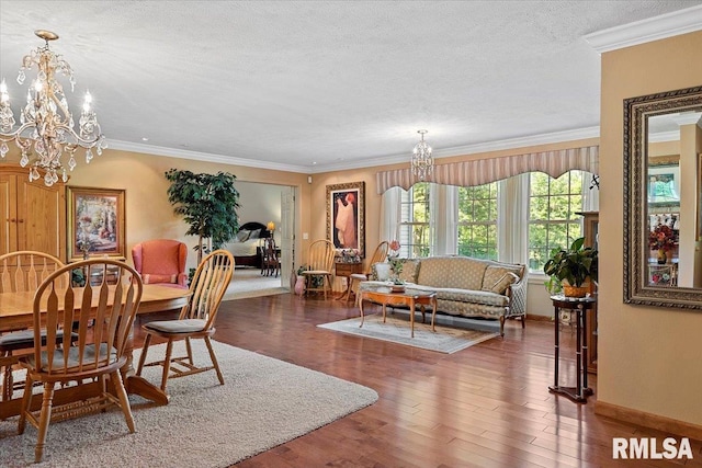 4 Nightingale Dr, Springfield, IL 62711 - dining space featuring a chandelier, wood finished floors, baseboards, a textured ceiling, and ornamental molding