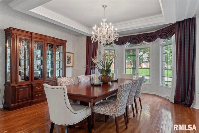 505 Clipper Rd, Springfield, IL 62704 - dining space with a chandelier, wood-type flooring, a tray ceiling, ornamental molding, and baseboards