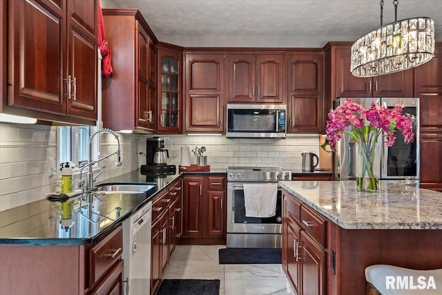505 Clipper Rd, Springfield, IL 62704 - kitchen featuring appliances with stainless steel finishes, reddish brown cabinets, a sink, light marble finish floors, and a textured ceiling