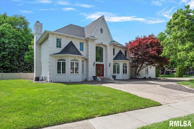 505 Clipper Rd, Springfield, IL 62704 - french country home featuring a chimney, brick siding, and french doors
