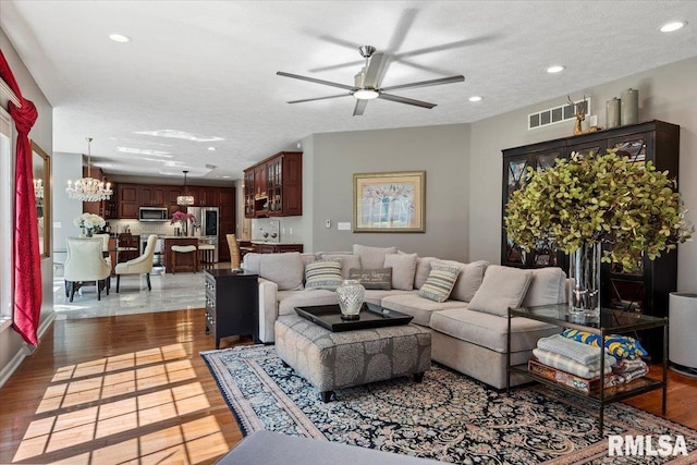 505 Clipper Rd, Springfield, IL 62704 - living room featuring a ceiling fan, a chandelier, wood finished floors, and recessed lighting