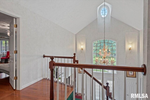 505 Clipper Rd, Springfield, IL 62704 - hall featuring a chandelier, wood finished floors, an upstairs landing, and high vaulted ceiling