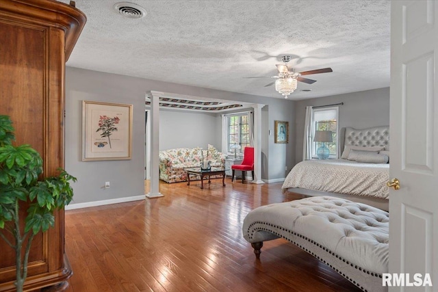 505 Clipper Rd, Springfield, IL 62704 - bedroom with baseboards, hardwood / wood-style flooring, and a textured ceiling
