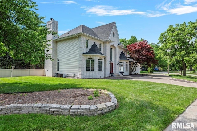 505 Clipper Rd, Springfield, IL 62704 - french country inspired facade featuring a chimney and central air condition unit