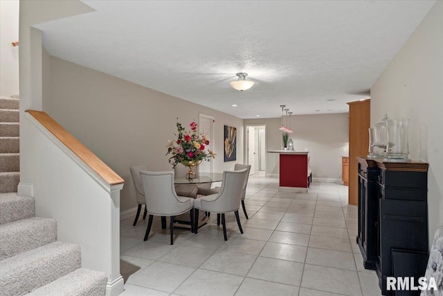 505 Clipper Rd, Springfield, IL 62704 - dining area with stairway, light tile patterned floors, baseboards, and a textured ceiling