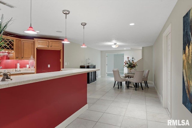 505 Clipper Rd, Springfield, IL 62704 - kitchen featuring light countertops, light tile patterned flooring, recessed lighting, hanging light fixtures, and baseboards