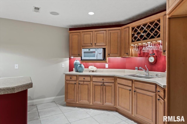 505 Clipper Rd, Springfield, IL 62704 - kitchen with a sink, white microwave, and brown cabinets