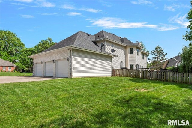 505 Clipper Rd, Springfield, IL 62704 - view of side of property with an attached garage, a shingled roof, and driveway